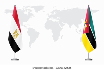 Egypt and Mozambique flags for official meeting against background of world map.