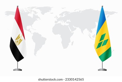 Egypt and Saint Vincent and the Grenadines flags for official meeting against background of world map.