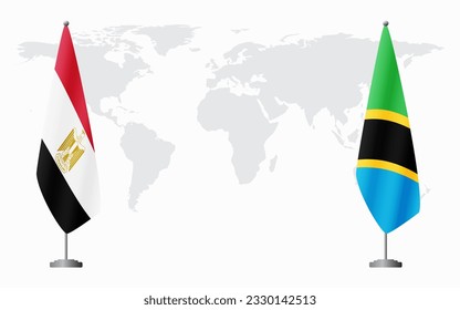 Egypt and Tanzania flags for official meeting against background of world map.