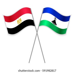 Egyptian and Basotho crossed flags. Egypt combined with Lesotho isolated on white. Language learning, international business or travel concept.