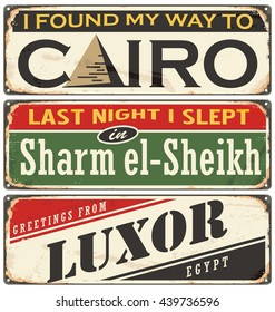 Egyptian cities and travel destinations. Retro metal plates set on old damaged background.