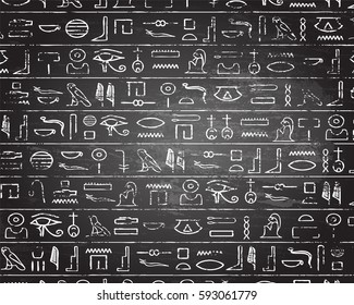 Egyptian Hieroglyphics On Blackboard Background
