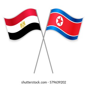 Egyptian and North Korean crossed flags. Egypt combined with North Korea isolated on white. Language learning, international business or travel concept.