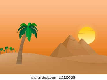 The Egyptian Pyramids of Giza at sunrise in the dune sand with orange sun in the background of palm trees with brown trunk with green leaves