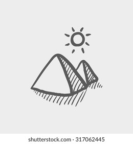 Egyptian pyramids sketch icon for web, mobile and infographics. Hand drawn vector dark grey icon isolated on light grey background.