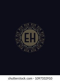 EH Initial logo. Ornament ampersand monogram grey logo black background