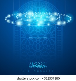 Eid Mubarak arabic calligraphy whit pattern ornament mosque window - Translation of text : Eid Mubarak - Blessed festival