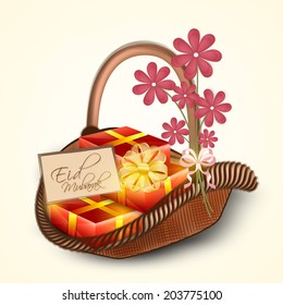 Eid Mubarak celebration concept with gift boxes and pink flowers on wooden basket. 
