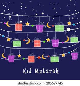 Eid Mubarak celebrations greeting card design with colourful gift boxes, moons and stars on blue background. 
