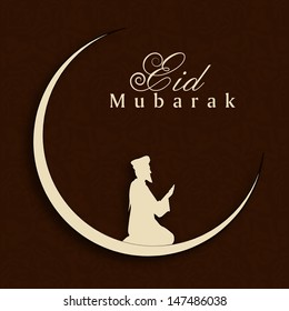 Eid Mubarak concept with silhouette of Muslim man praying (Namaz, Islamic prayer) on abstract brown background. 