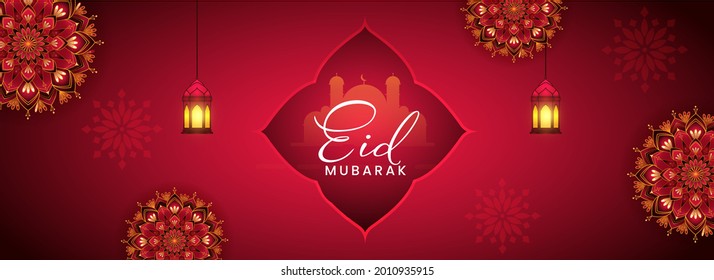 Eid Mubarak Font With Silhouette Mosque, Lit Lanterns Hang And Exquisite Mandala Decorated Red Background.