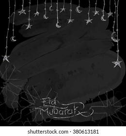 Eid Mubarak greeting background chalk on balckboard - Translation of text : Eid Mubarak - Blessed festival