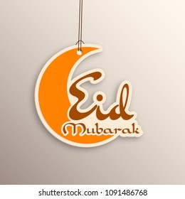 Eid Mubarak greeting card with intricate calligraphy and artistic moon for the celebration of Muslim community festival.