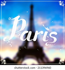 Eiffel tour blurred background with white calligraphic sign "Paris"