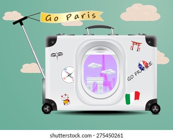 Eiffel tower and Arc de Triomphe see through the air plane window on the gray suitcase baggage on blue background concept of travel paris france