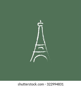 Eiffel Tower hand drawn in chalk on a blackboard vector white icon isolated on a green background.