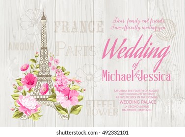 Eiffel tower icon with spring blooming flowers over gray wooden texture with wedding invitation sign. Vector illustration.