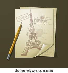 eiffel tower on white paper with pens and pancil on top of   table