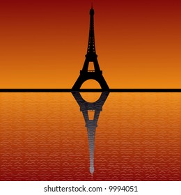 Eiffel tower reflected in water at sunset