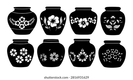 Eight black ceramic jars featuring intricate white floral patterns, showcasing traditional craftsmanship and decorative artistry.