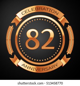 Eighty two years anniversary celebration with golden ring and ribbon.