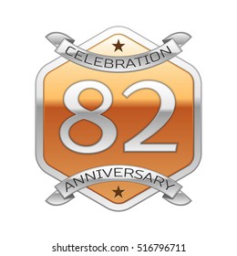 Eighty two years anniversary celebration silver logo with silver ribbon and golden hexagonal ornament on white background.