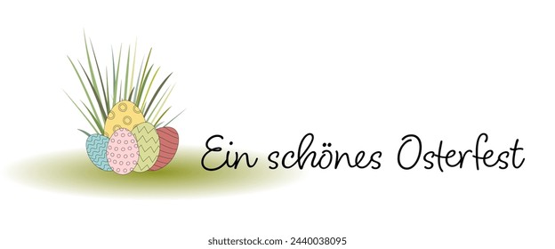 Ein schönes Osterfest - text in German language - Happy Easter. Greeting card with colorful Easter eggs in the grass.