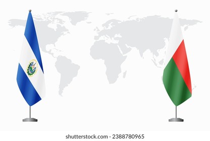 El Salvador and Madagascar flags for official meeting against background of world map.