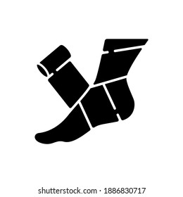 Elastic bandage black glyph icon. Suffer from injury. Hurt foot. Join trauma treatment. Medical equipment to help patient. Health care. Silhouette symbol on white space. Vector isolated illustration