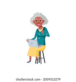 elderly african woman surfing in internet on computer cartoon vector. elderly african woman surfing in internet on computer character. isolated flat cartoon illustration