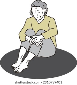 Elderly Asian woman sitting lonely