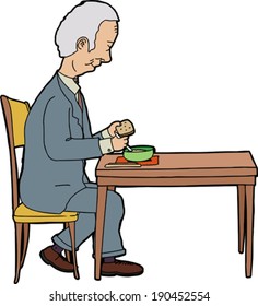 Elderly businessman sitting at table with food