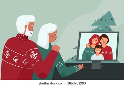 An elderly couple communicates with relatives through a video conference. Christmas and new year online. Quarantine conditions of the celebration.