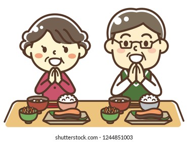 An elderly couple eating Japanese food