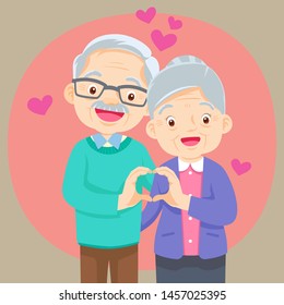 Elderly couple holding hands  make shape of heart.Grandmother and grandfather together. Grandparents. Elderly couple. A man and a woman of old age.hand heart shape