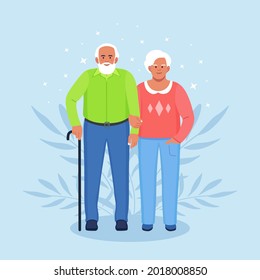 Elderly couple holding hands. Seniors grandmother and grandfather together. Grandparents. Old bearded man and woman. Happy family 