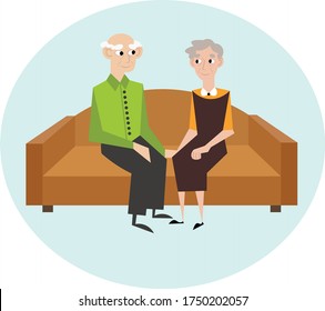 Elderly couple at home. Recreation at home, self-isolation for the elderly. Grandma and grandpa are sitting on the couch.