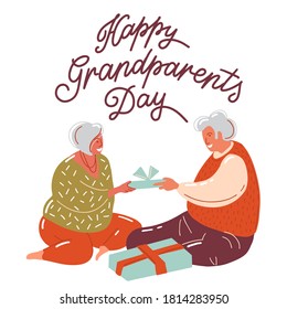 Elderly couple hug and love each other. gray-haired people exchange flogs. happy seniors day! grandparents day