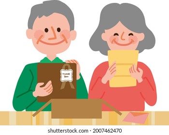 An Elderly Couple Opening A Present