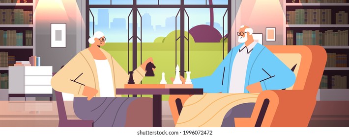 elderly couple playing chess senior man woman spending time together living room interior horizontal