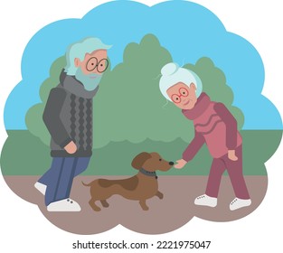 Elderly couple playing with a dog on a walk in the park