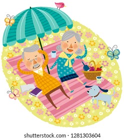 Elderly couple relaxing on beach