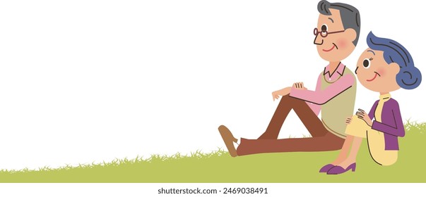 Elderly couple sitting on the grass and looking into the distance