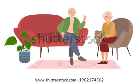 Elderly couple sitting on the sofa at home on white background. Retired elderly couple in love. Grandparents family, grandmother and grandfather happy friends sitting on the couch communicating