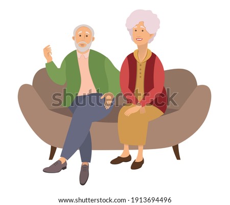 Elderly couple sitting on the sofa at home isolated on white background. Retired elderly couple. Grandparents family, grandmother and grandfather happy friends sitting on the couch communicating