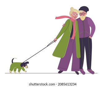 Elderly couple spends time outdoors. Aged man and woman walking with dog