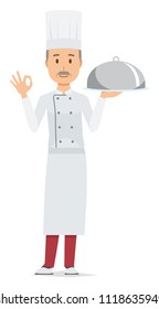 An elderly male chef wearing a cook coat has the dish which he cooked