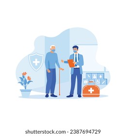 An elderly male patient wearing a mask visits a health clinic. She received support from young male doctors during the pandemic. Doctor Talking To Elderly Patient At Home concept. 
