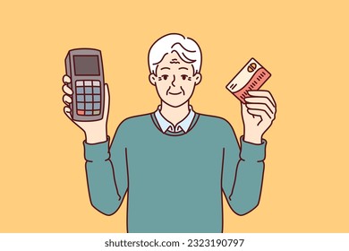 Elderly man holds POS terminal and bank card for making cashless payments in supermarket. Grey-haired store owner recommends using POS equipment for retail business and customer service