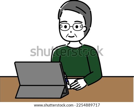 Elderly man operating a tablet with a smile